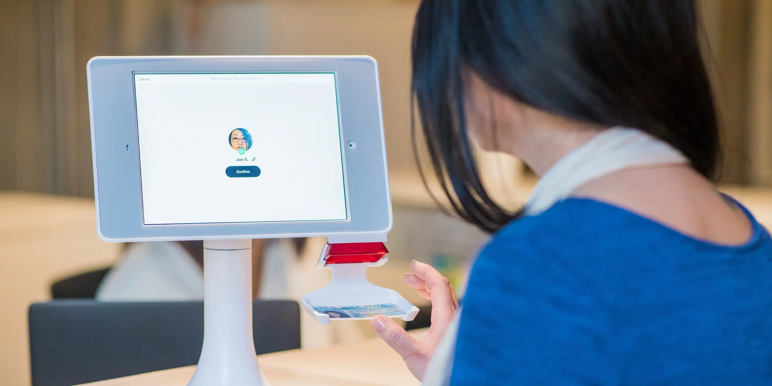 woman using facial recognition access control